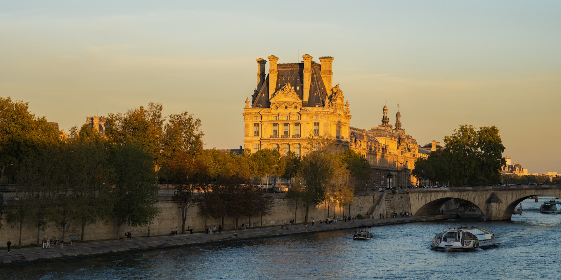 a river running through a city next to a bridge